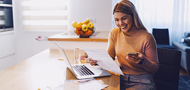 Woman reviewing mortgage papers