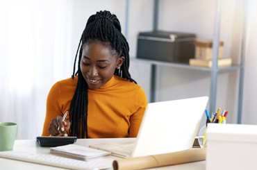 Woman at computer applying for mortgage